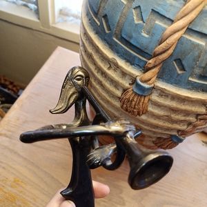 Bronze Statue of lady playing trumpet